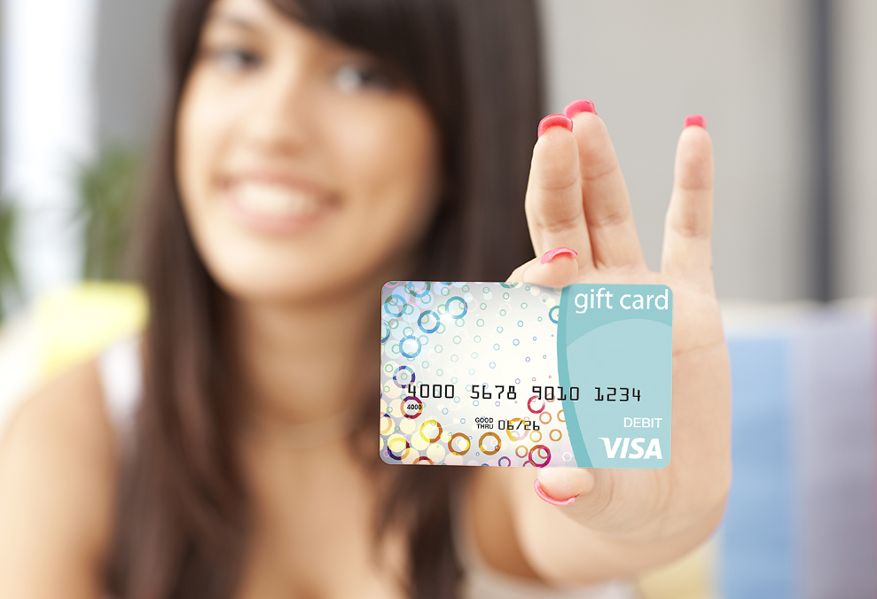 Woman Holing a Visa Gift Card
